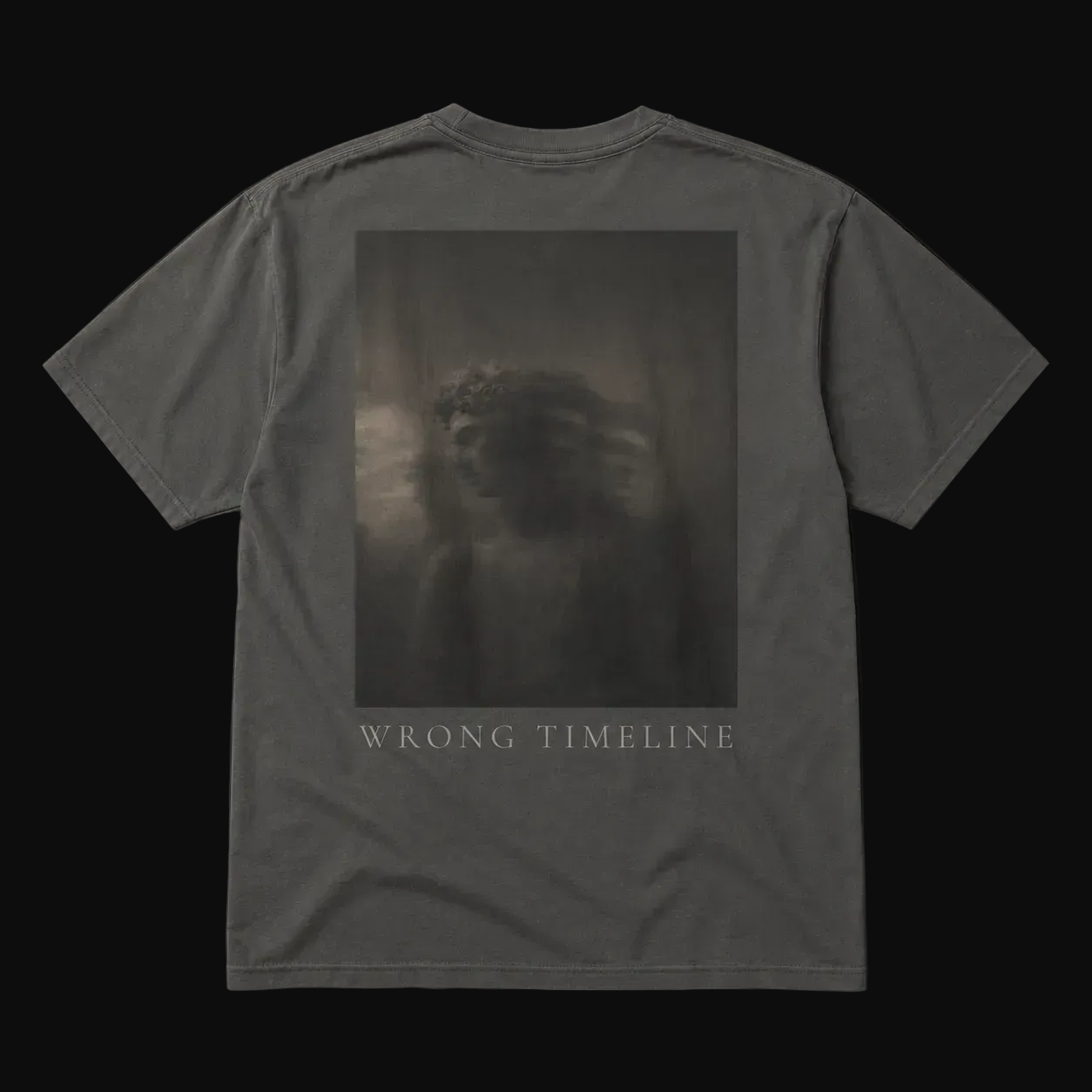 Gray t-shirt with a graphic design and 'Wrong Timeline' text on a black background